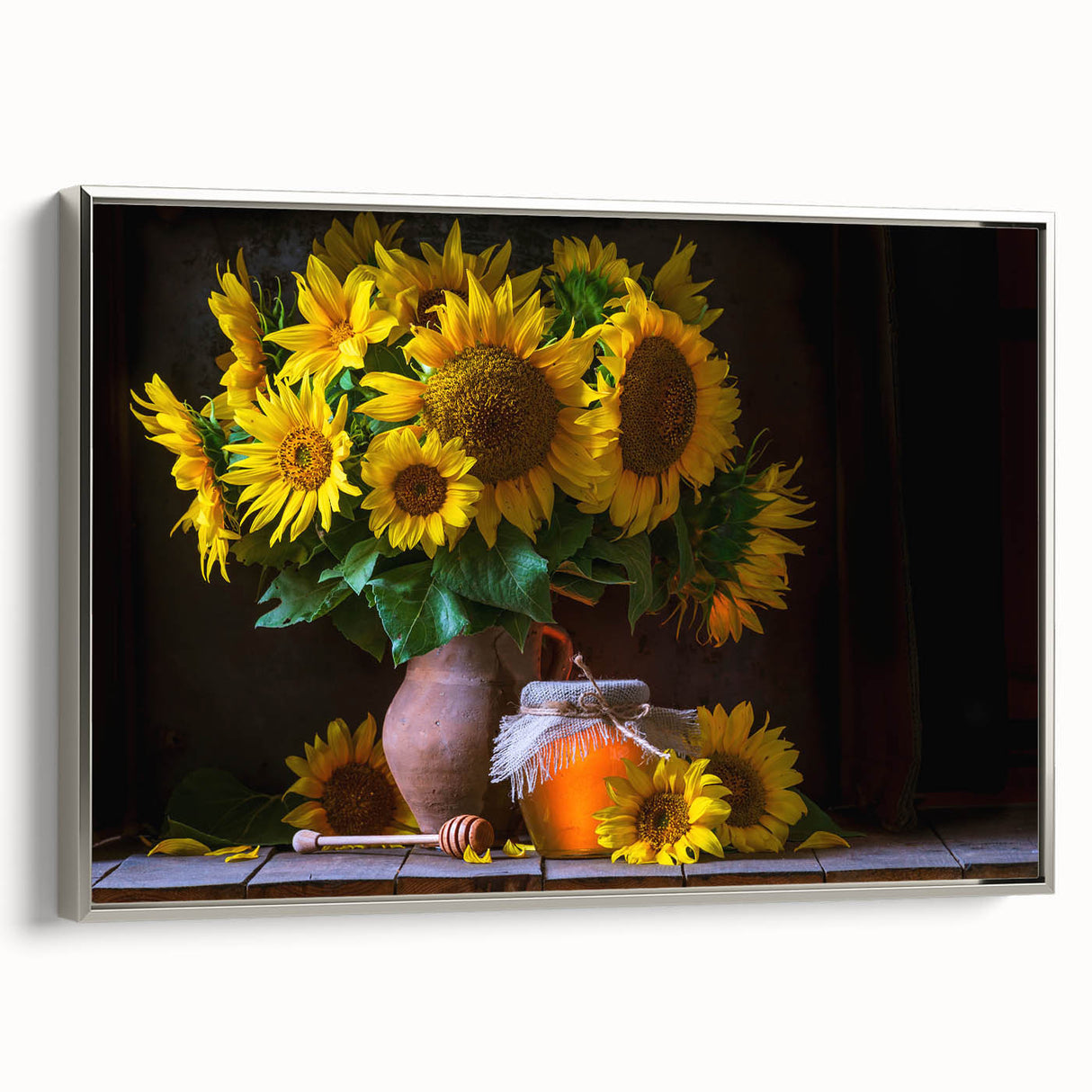 Framed canvas wall art showcasing a vibrant sunflower botanical design, elegantly bordered in silver, ideal for brightening home decor with a touch of nature.