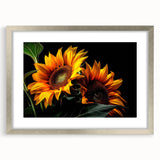 Botanical wall art featuring a vibrant sunflower design, elegantly framed with a silver mat, perfect for enhancing home decor with a touch of nature.