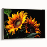 Framed canvas wall art featuring a vibrant botanical sunflower design with a silver frame; perfect for adding a touch of nature-inspired elegance to any space.