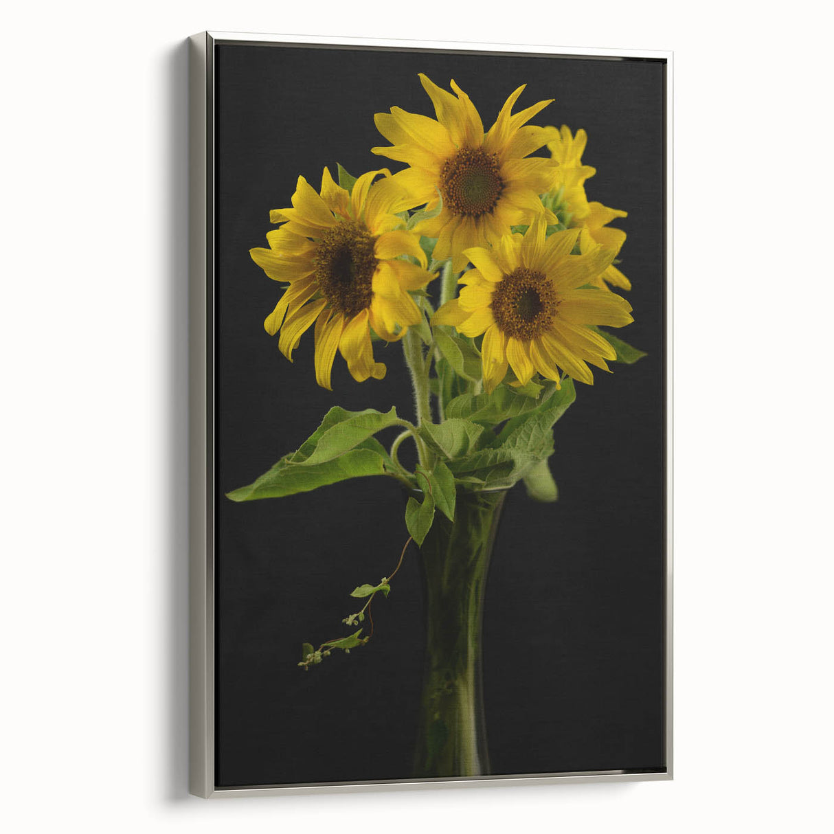 Framed botanical wall art featuring a vibrant sunflower design on a textured canvas, elegantly displayed with a silver frame, perfect for home decor.
