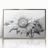 Framed wall art showcasing a vibrant botanical design featuring sunflowers, set in an elegant silver frame, ideal for brightening home decor.