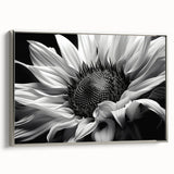 Framed canvas wall art featuring a botanical sunflower design with vibrant yellow petals and intricate details, showcased from a silver side view in an elegant setting.