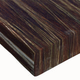 Close-up of a vibrant botanical wall art canvas featuring delicate flowers and trees, showcasing intricate details and rich colors, perfect for home decor.