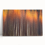 Vibrant botanical wall art canvas featuring a collection of colorful flowers and trees, elegantly leaning against a wall, perfect for home decor enhancement.