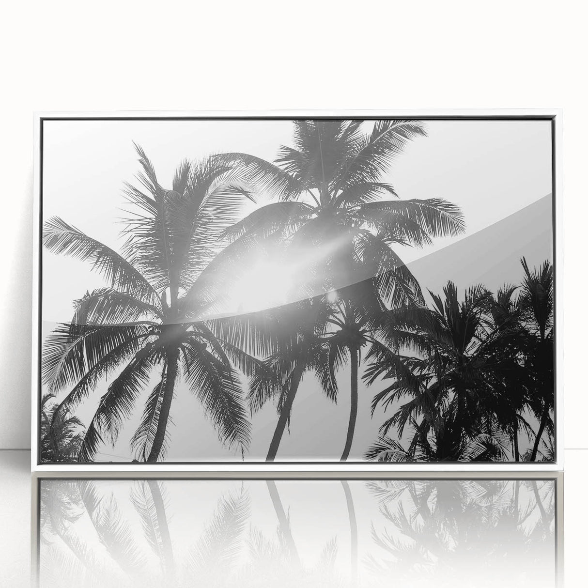 Framed botanical wall art featuring a collection of delicate flowers and trees in soft colors, displayed against a white background, ideal for home decor enhancement.