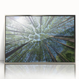 Framed wall art featuring a botanical design of colorful flowers and trees, set in a sleek silver frame, ideal for modern home decor. Perfect for enhancing any living space with nature-inspired aesthetics.