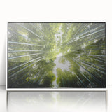 Framed wall art showcasing a botanical tree design with vibrant floral elements, displayed in a white frame, perfect for enhancing home decor aesthetics.