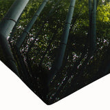 Close-up view of a botanical wall art design featuring vibrant flowers and trees on stretched canvas, showcasing intricate details and vivid colors for home decor.