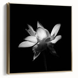Framed wall art featuring a vibrant botanical tropical flower design in silver and gold tones, set against a sleek background, ideal for modern decor. This artwork adds a touch of elegance and nature-inspired beauty to any living space.