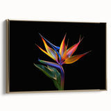 Framed wall art featuring a vibrant tropical floral design with gold accents, showcasing lush botanical elements and a modern aesthetic perfect for home decor.