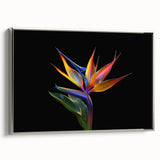 Framed canvas wall art showcasing a vibrant tropical flower design, featuring rich colors and intricate botanical details, presented from a silver side view.