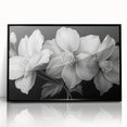 Framed wall art showcasing a vibrant tropical flower design, featuring rich colors and intricate details, set against a sleek black frame, perfect for home decor.