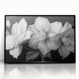 Framed wall art showcasing a vibrant tropical flower design, featuring rich colors and intricate details, set against a sleek black frame, perfect for home decor.