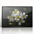 Framed wall art showcasing a vibrant tropical botanical flower design with a sleek black frame, perfect for adding a touch of nature to modern decor.