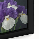 Vibrant close-up of a framed botanical tropical flower wall art piece, showcasing intricate details of lush green leaves and colorful blooms, perfect for home decor.