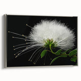 Framed canvas artwork showcasing a vibrant tropical flower design in shades of pink and green, elegantly displayed with a sleek silver frame, perfect for modern decor.