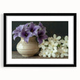 Tropical botanical wall art collection featuring vibrant flowers in a black frame with a mat. Ideal for enhancing home decor with a botanical theme.