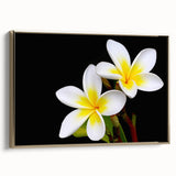 Framed wall art featuring a vibrant botanical tropical flower design in gold tones, showcasing lush foliage and intricate details, perfect for home decor.