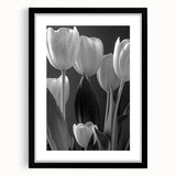 Framed botanical wall art showcasing a vibrant tulip design in a black frame with matting, ideal for enhancing home decor and adding a touch of nature.
