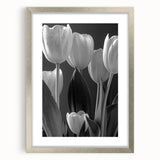 Botanical wall art featuring a delicate tulip design in a silver frame with a mat, showcasing vibrant colors and intricate details, perfect for home decor.