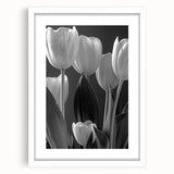 Framed botanical wall art featuring a delicate tulip design in soft pastel colors, set against a white mat. Ideal for modern home decor and floral enthusiasts.