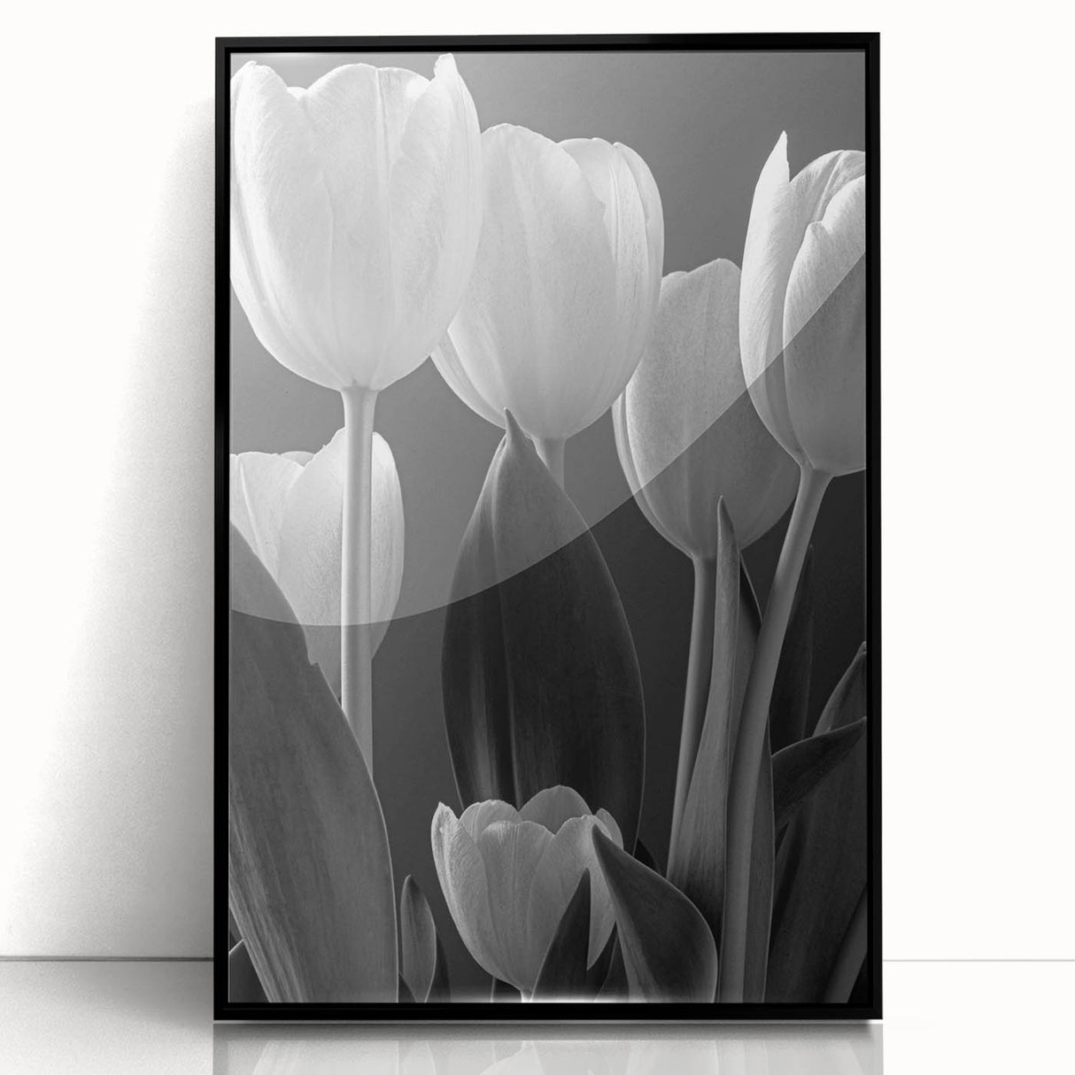 Framed wall art featuring a botanical tulip design in vibrant colors, displayed in a sleek black frame, perfect for adding elegance to home decor.