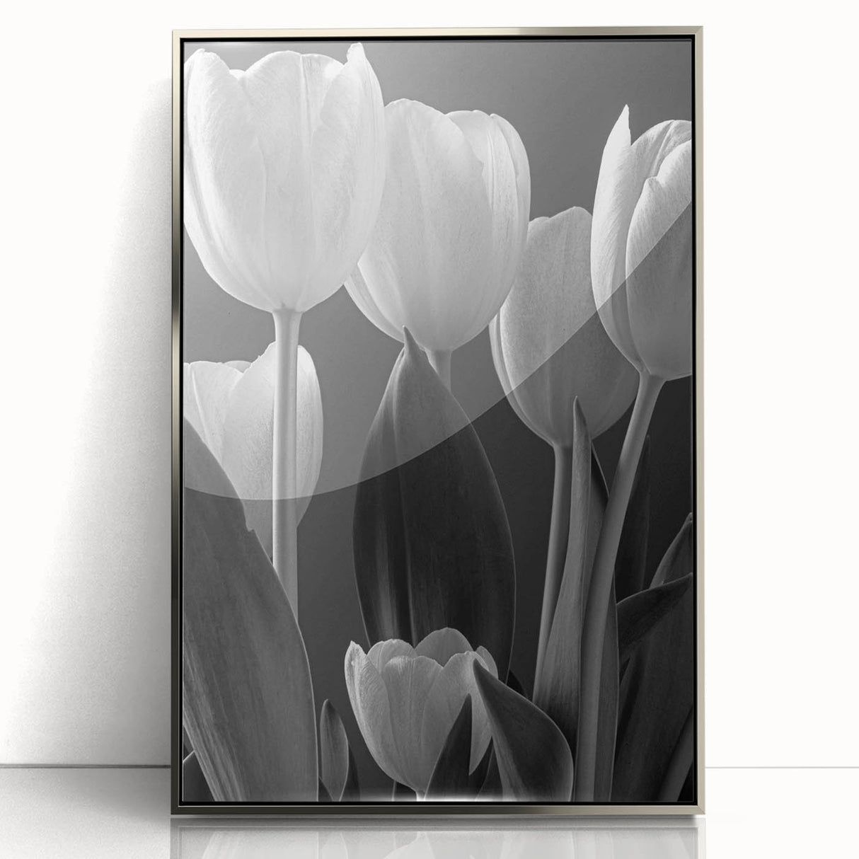 Framed wall art featuring a botanical design of vibrant tulips in shades of pink and yellow, set in a sleek silver frame, ideal for enhancing home decor.
