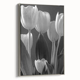 Framed botanical wall art featuring a vibrant tulip design on canvas, set in a sleek silver frame, showcasing a side view that highlights its elegant details.
