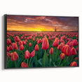 Framed botanical wall art featuring a vibrant tulip design on canvas, presented in a sleek black frame, showcasing its elegant side profile against a neutral backdrop.