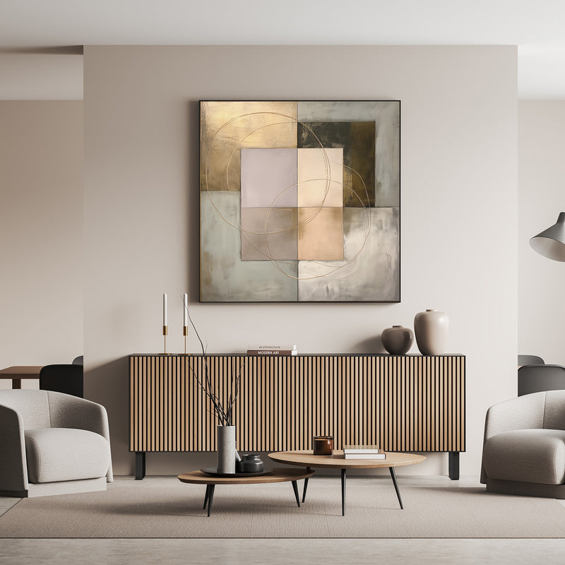 Geometric abstract wall art with metallic tones above mid-century wood sideboard in gray room