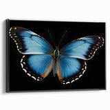 Framed canvas wall art featuring a vibrant butterfly design with intricate details, set against a sleek black frame, ideal for home decor and nature enthusiasts.