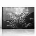 Framed wall art featuring a vibrant butterfly design with intricate details, set in a sleek black frame, perfect for enhancing modern decor. Ideal for nature lovers and art enthusiasts.