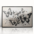 Framed wall art collection showcasing intricate butterfly and arachnid designs in vibrant colors against a sleek black background, ideal for nature enthusiasts and modern decor.