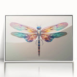 Framed wall art featuring a vibrant dragonfly design, showcasing intricate details and a white frame, perfect for adding a touch of nature-inspired decor to any space.