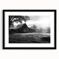 Framed wall art featuring a serene landscape of a rustic barn, with a black mat and sleek black frame, ideal for enhancing home decor and creating a cozy atmosphere.