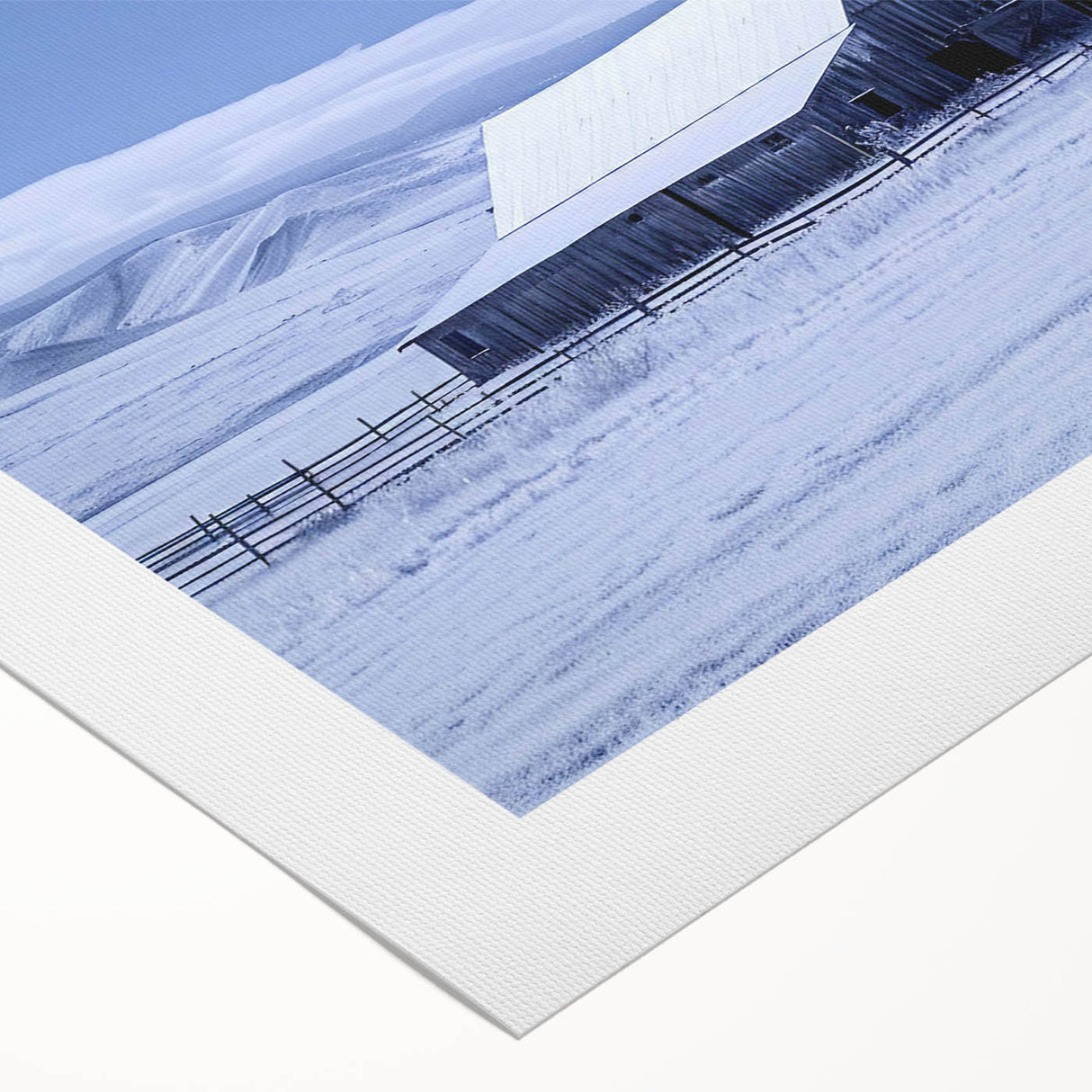 Rolled canvas wall art featuring a serene landscape with a rustic red barn surrounded by lush green fields and a vibrant blue sky, ideal for home decor.