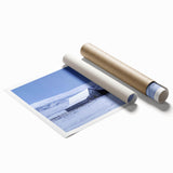 Vintage barn landscape wall art print showcasing a serene rural scene with lush green fields and a cloudy sky, rolled and ready for framing, perfect for home decor.