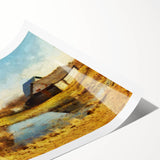 Rustic barn landscape wall art print showcasing vibrant green fields and a serene blue sky, rolled for easy transport and display in a stylish home decor setting.