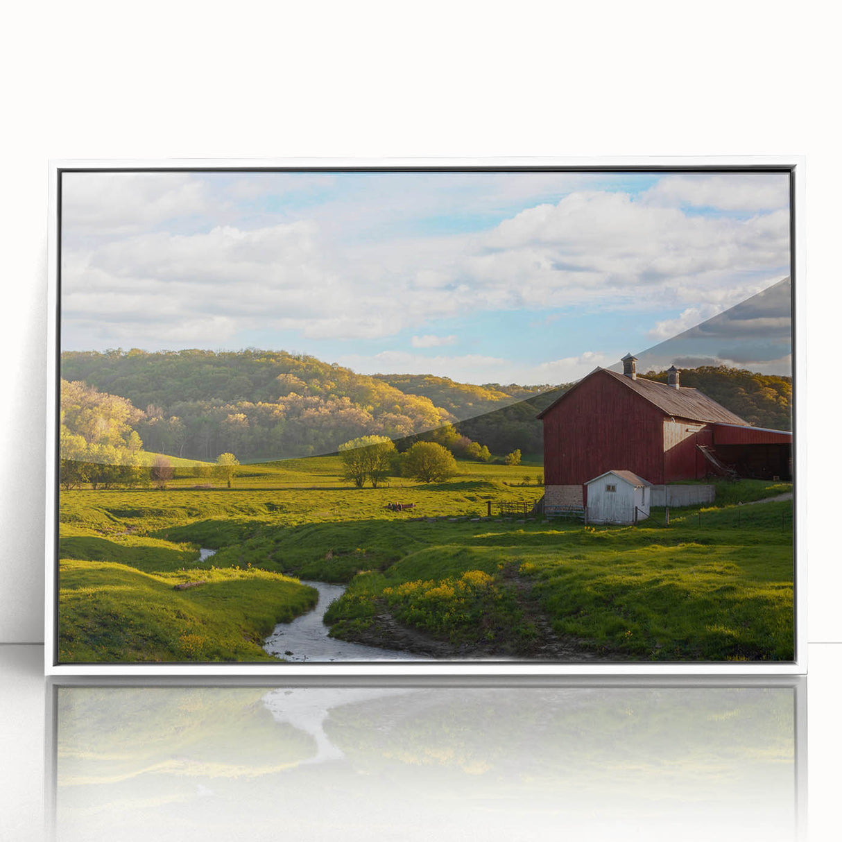 Framed acrylic wall art showcasing a serene landscape with a rustic barn, set against a vibrant sunset. The artwork features warm colors and intricate details, perfect for home decor enthusiasts.
