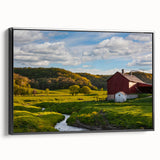Framed canvas wall art showcasing a picturesque landscape with a rustic barn, set against a vibrant sunset; features a sleek black frame and adds charm to any decor.