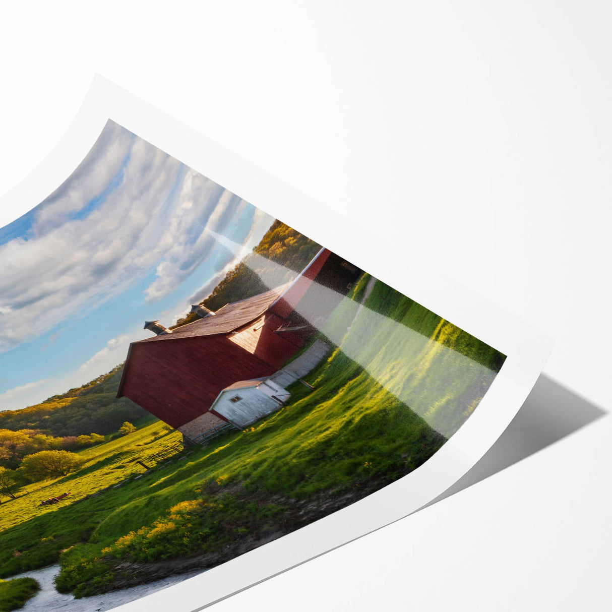 Rustic landscape barn wall art print showcasing a vibrant sunset over a serene field, rolled for easy transport and display in home décor. Perfect for nature lovers.