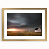 Framed wall art showcasing a scenic landscape of rustic barns, set in a gold frame with a mat, perfect for enhancing home decor and creating a cozy atmosphere.
