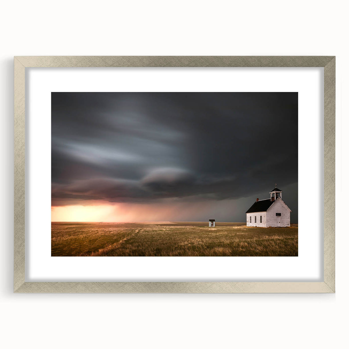 Elegant silver-framed wall art featuring a serene landscape with a rustic barn, showcasing muted earth tones and a soft matte finish, perfect for home decor.
