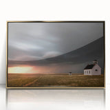 Framed wall art featuring a serene landscape with a rustic barn, highlighted by a gold-accented frame, perfect for enhancing home decor and adding warmth to any room.