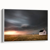 Framed canvas wall art showcasing a serene landscape with a rustic barn, featuring soft colors and a white frame, perfect for home decor enhancement.