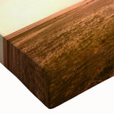 Close-up of a stretched canvas wall art piece showcasing a rustic barn landscape, featuring warm earthy tones and intricate textures, ideal for home decor enthusiasts.