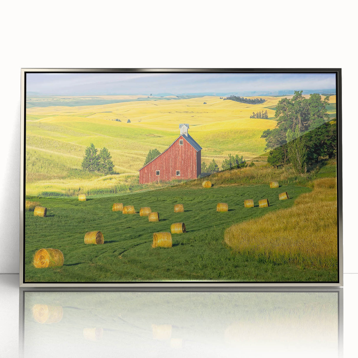 Framed acrylic wall art showcasing a scenic landscape with a rustic barn, featuring silver accents and a contemporary design, perfect for home decor.