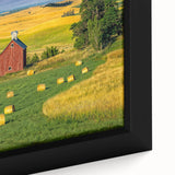 Framed canvas wall art showcasing a rustic barn landscape with vibrant green fields and a clear blue sky, offering a serene rural aesthetic for home decor.