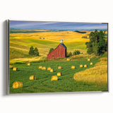 Framed canvas wall art depicting a serene landscape with a rustic barn, featuring a silver frame, perfect for enhancing home decor in a cozy setting.