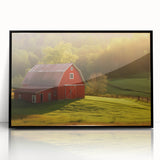 Framed acrylic wall art featuring a serene landscape with a rustic barn, set against a vibrant sunset. This black-framed design adds a modern touch to home decor.